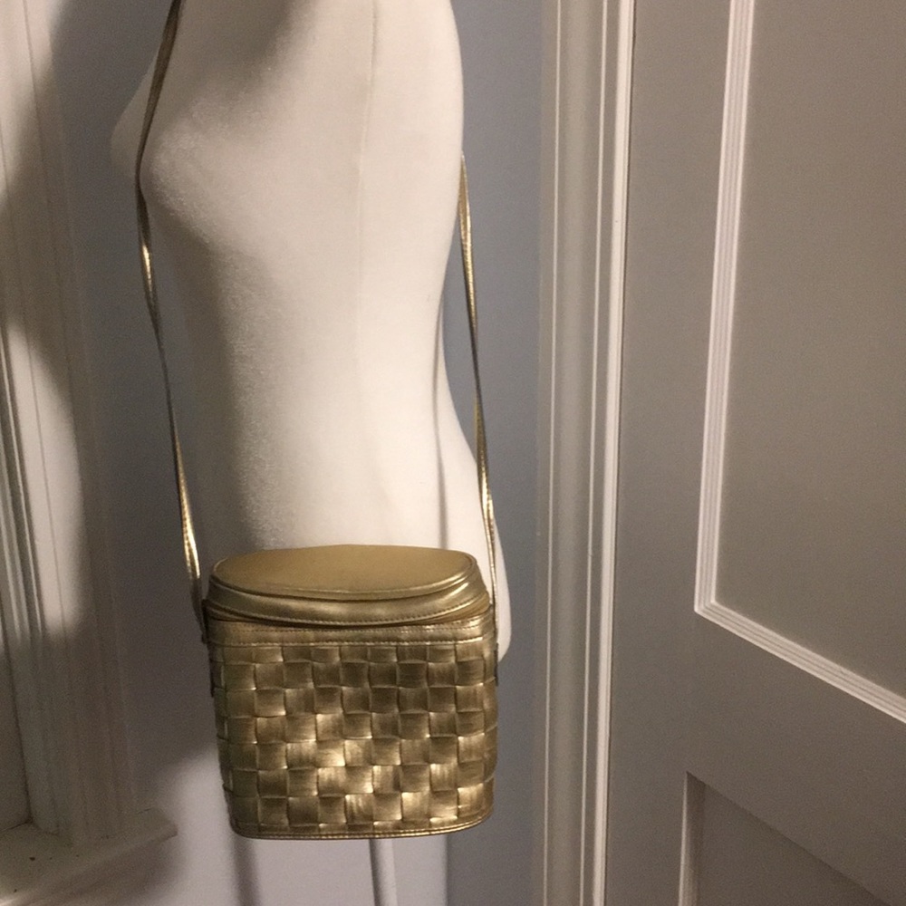 Gold woven bucket style handbag buy saddle River